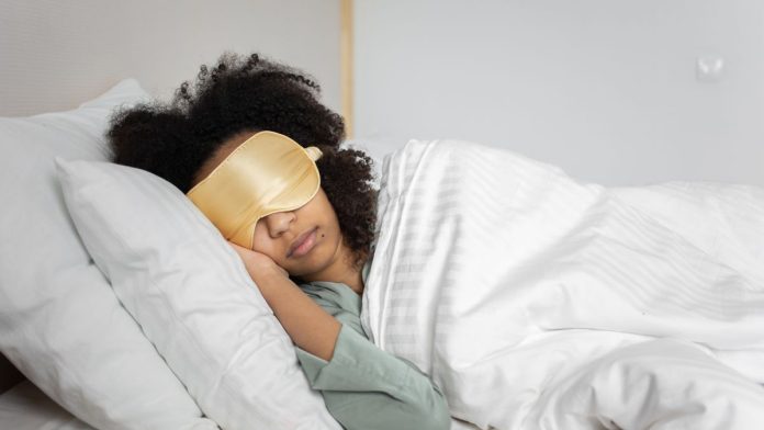 Person sleeping peacefully in bed