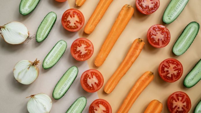 Fresh vegetables and whole foods arranged on a table