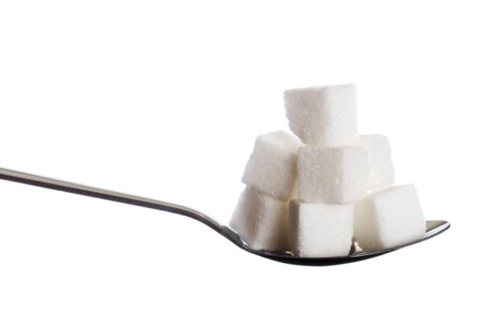 Sugar cubes on a spoon