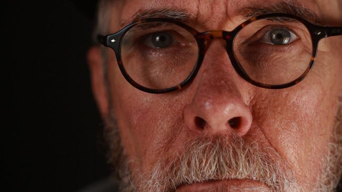 Thoughtful middle-aged man looking to the side