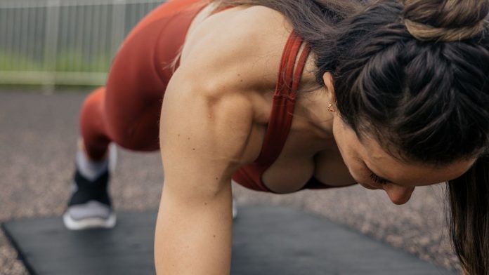 Woman holding a plank position during a core workout
