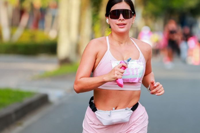 Woman jogging outdoors in the morning, showing how exercise improves sleep