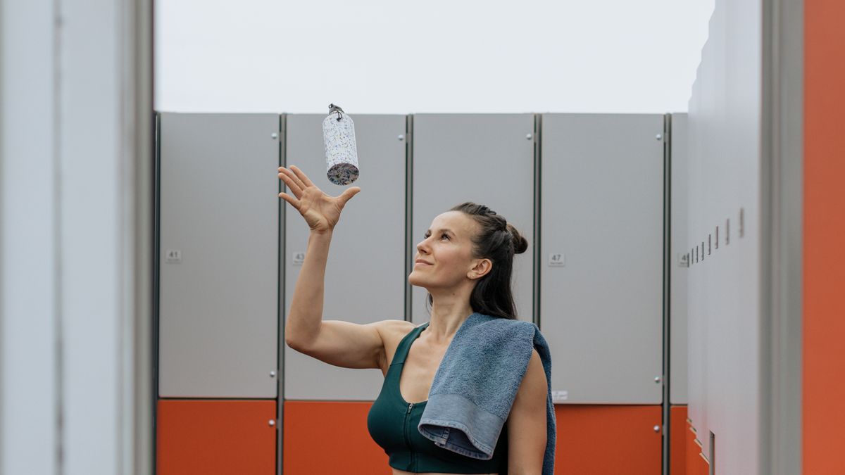 Woman recovering with water after a high-intensity interval training session