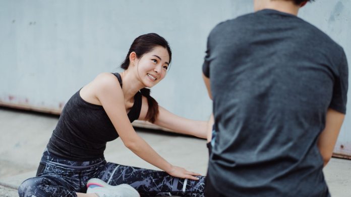 Woman doing a gentle low-impact stretching workout that is easy on the joints