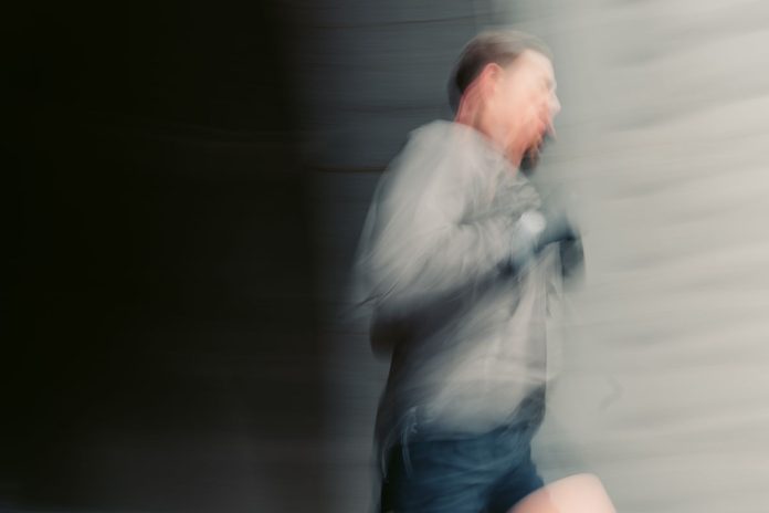 Energetic man running outdoors