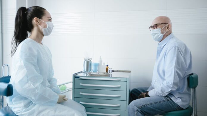 A man consulting a doctor about his health