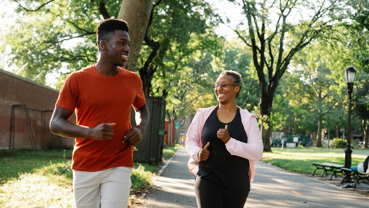 Man jogging outdoors in a park to support brain health and memory