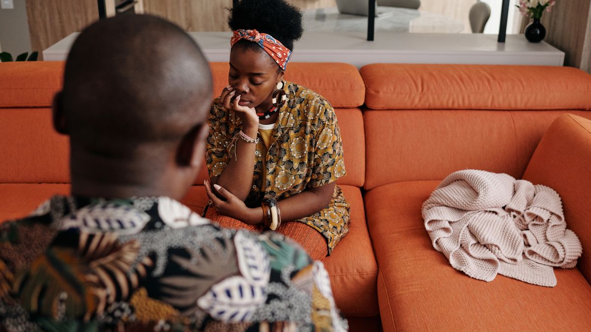 Couple having an honest conversation about mismatched libidos on the sofa