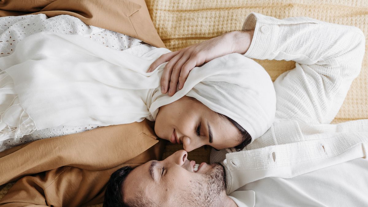 Couple reconnecting and lying face to face, rebuilding intimacy despite mismatched libidos