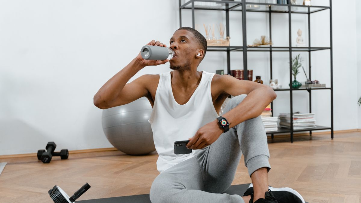 Man drinking water to stay hydrated and help prevent kidney stones