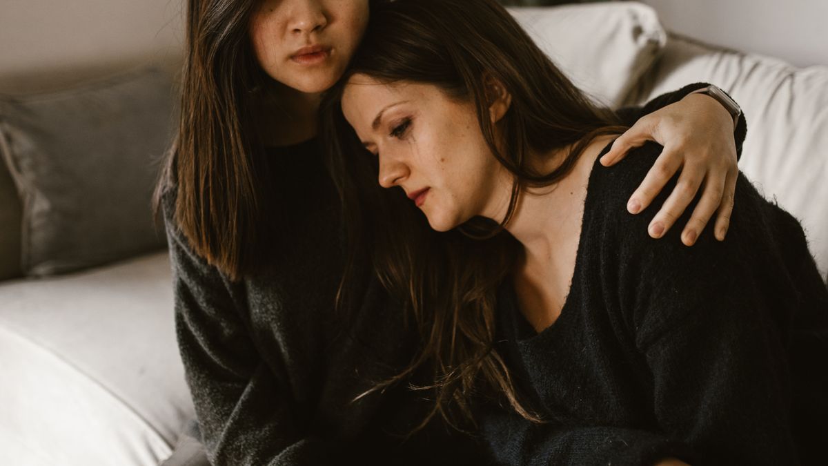 Woman comforting her crying friend by listening instead of offering toxic positivity